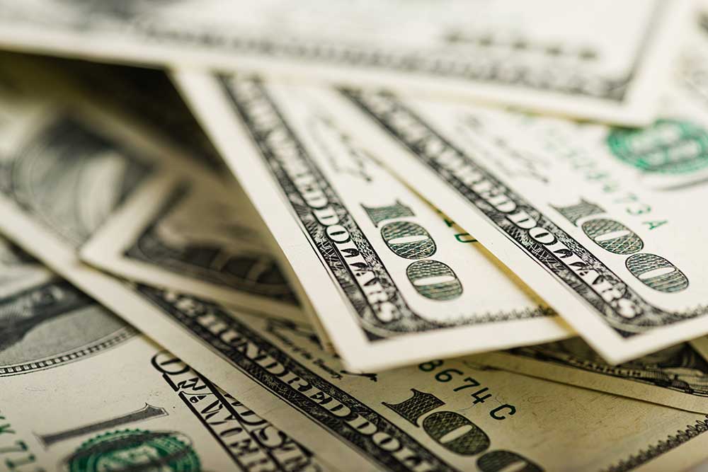 Chairs, grill, and bicycle outside of a motorhome seen while preforming RV inspection services